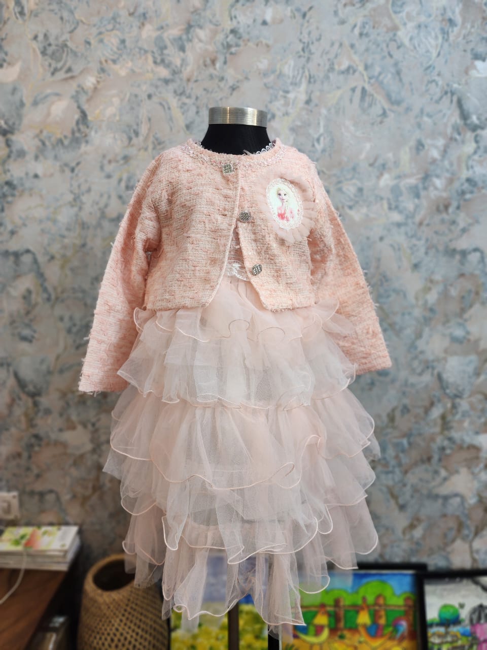 Elegant light pink baby girl winter dress with embroidered jacket and flowing ivory tulle skirt, perfect for special celebrations