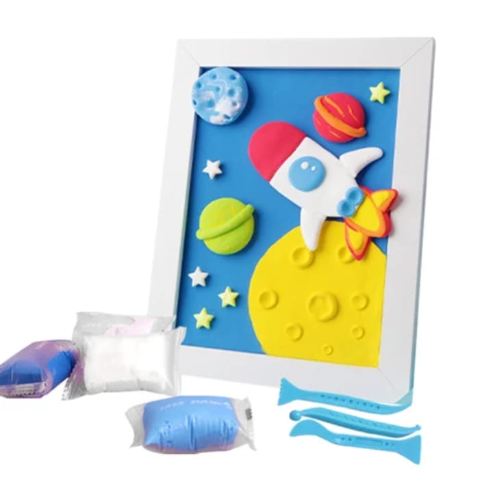 Rocket blue space clay picture frame with colorful 3D air-dry clay planets, stars and space details - cosmic kids craft for space exploration
