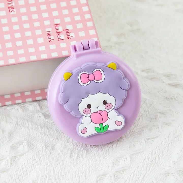 Foldable travel comb with adorable character illustration and round mirror case