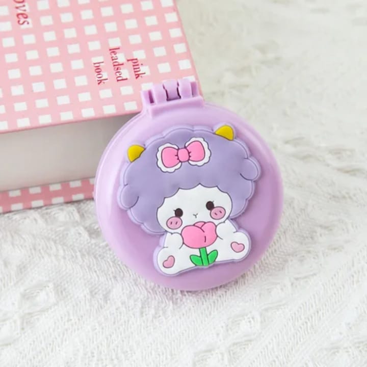 Foldable travel comb with adorable character illustration and round mirror case