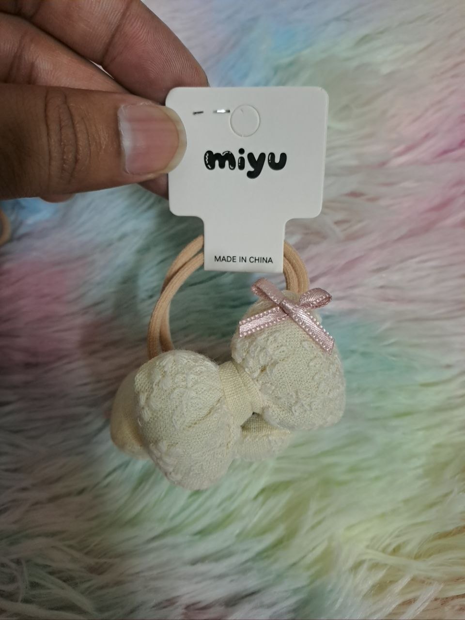 Miyu brand cream-colored fabric bow hair ties with textured lace material and pink ribbon accents for girls