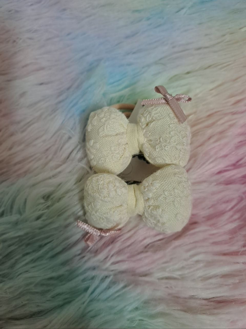 Miyu brand cream-colored fabric bow hair ties with textured lace material and pink ribbon accents for girls