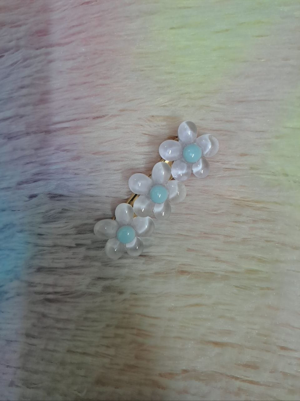 Assorted glossy resin hair clips in star, heart, flower, and bead shapes with smooth colorful finish for girls