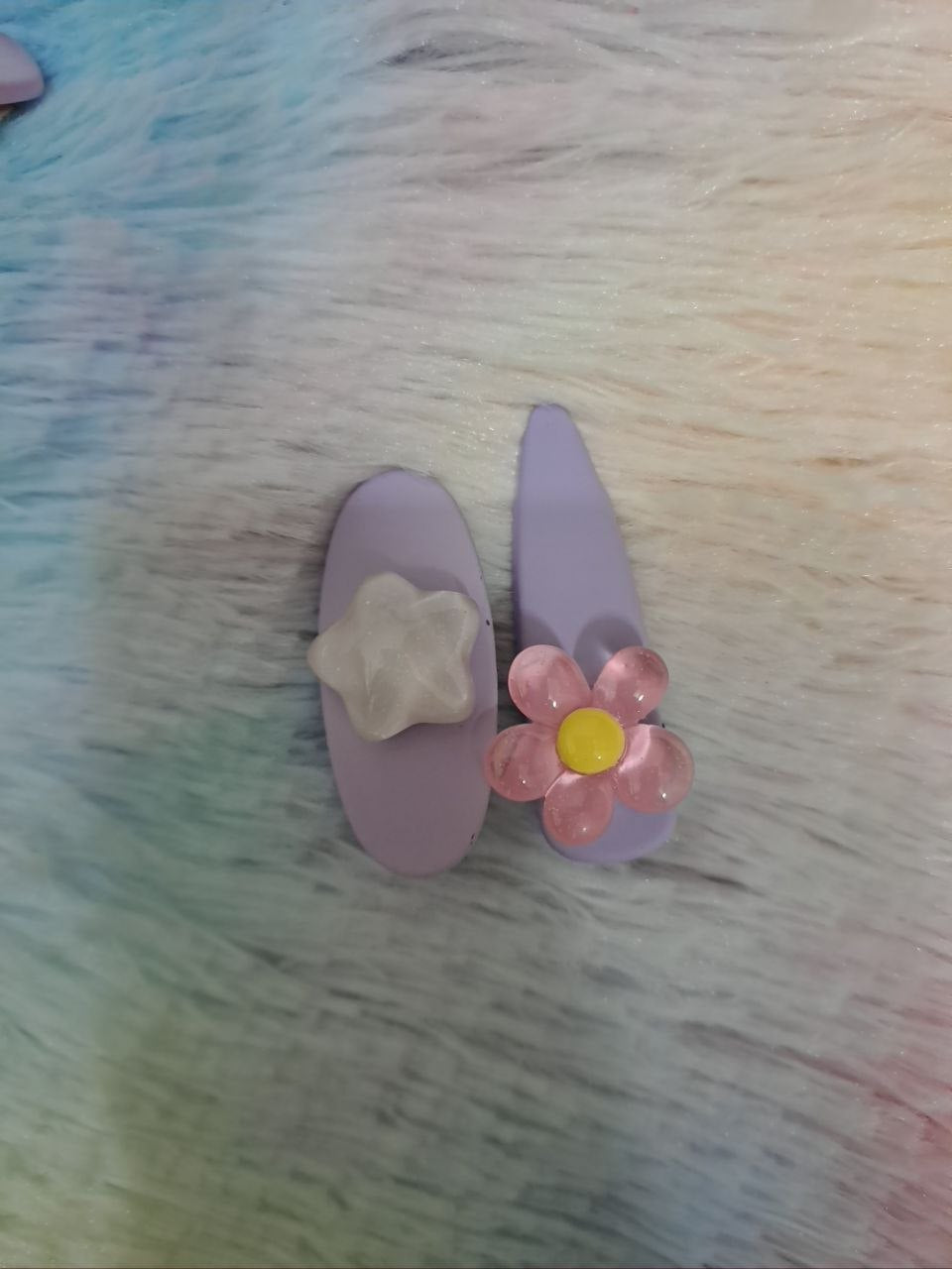 Assorted glossy resin hair clips in star, heart, flower, and bead shapes with smooth colorful finish for girls