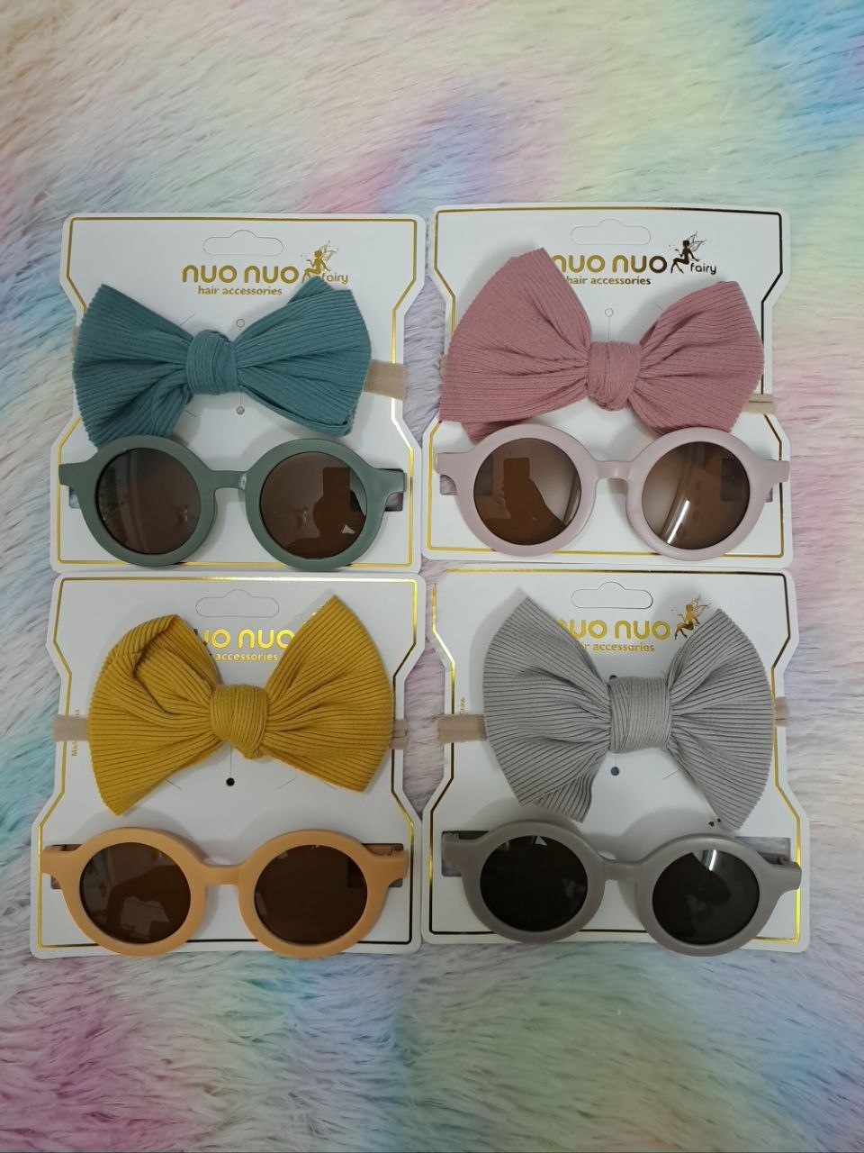 Nuo Nuo Fairy brand coordinated sets featuring ribbed fabric bow headbands paired with matching round children's sunglasses in teal, pink, yellow, and gray