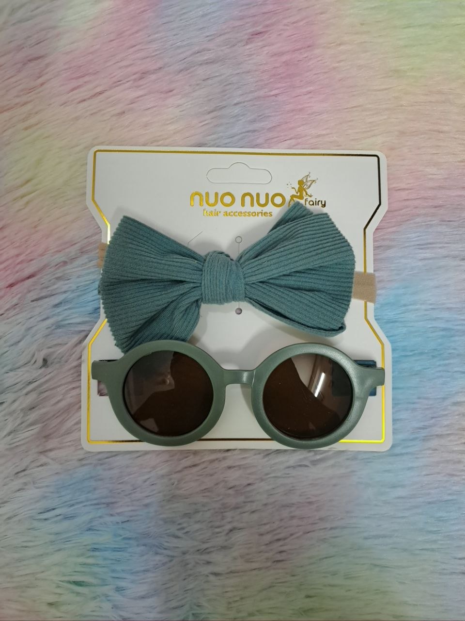 Nuo Nuo Fairy brand coordinated sets featuring ribbed fabric bow headbands paired with matching round children's sunglasses in teal, pink, yellow, and gray
