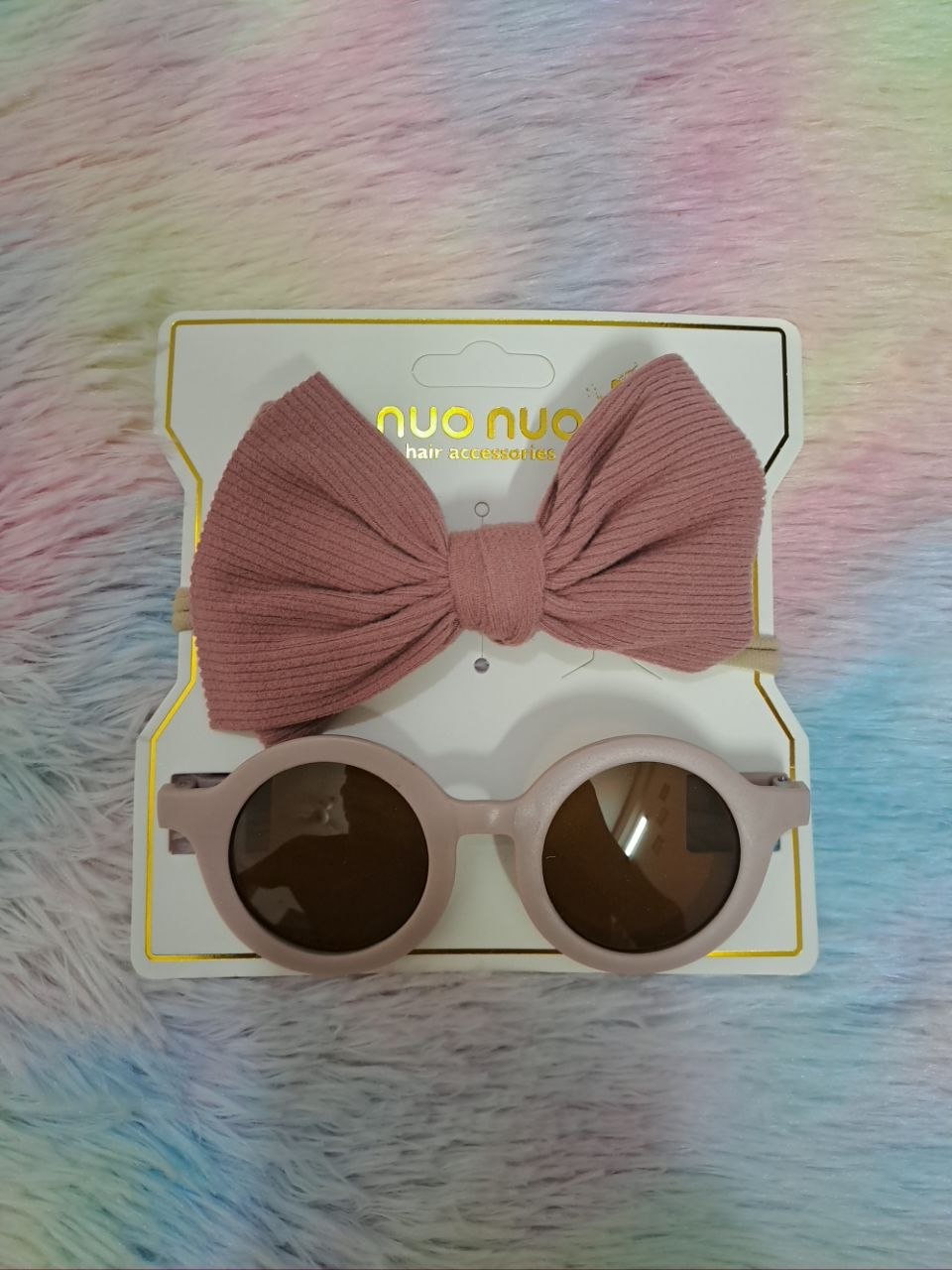Nuo Nuo Fairy brand coordinated sets featuring ribbed fabric bow headbands paired with matching round children's sunglasses in teal, pink, yellow, and gray