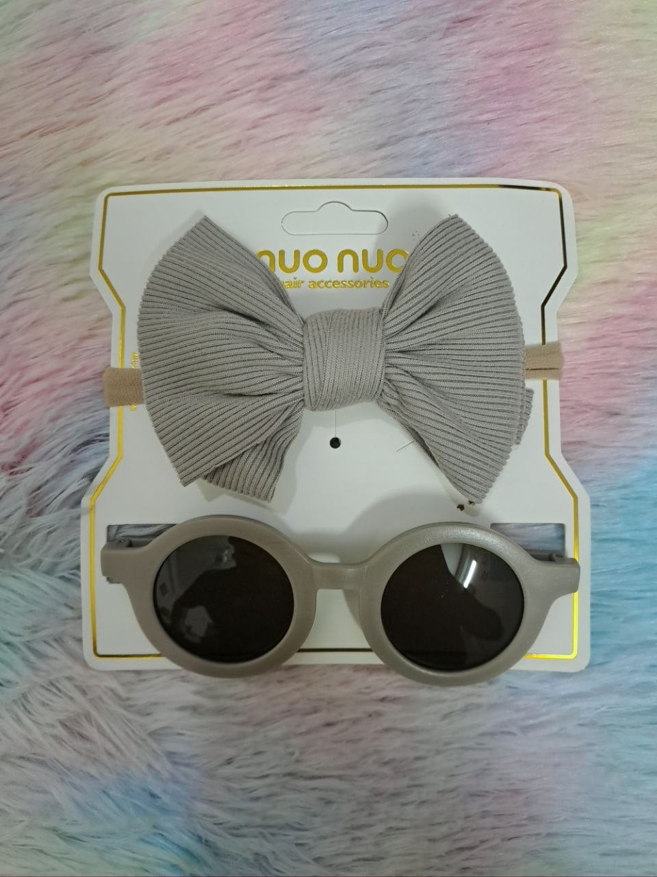Nuo Nuo Fairy brand coordinated sets featuring ribbed fabric bow headbands paired with matching round children's sunglasses in teal, pink, yellow, and gray