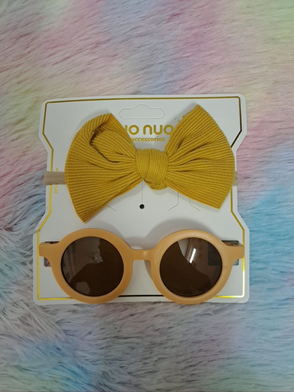 Nuo Nuo Fairy brand coordinated sets featuring ribbed fabric bow headbands paired with matching round children's sunglasses in teal, pink, yellow, and gray
