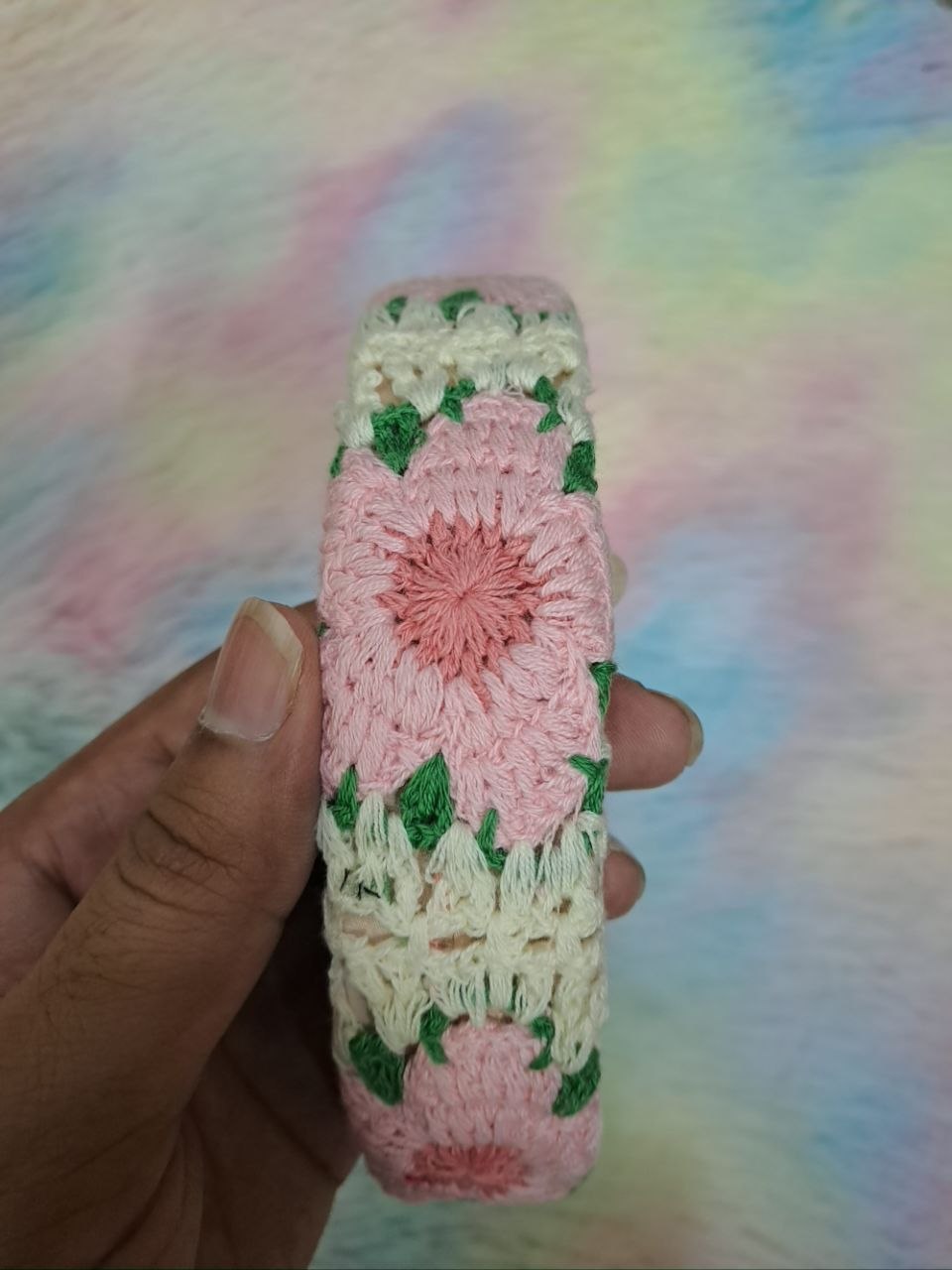 Handcrafted crocheted headbands with intricate braided floral patterns in multicolor combinations including pink, green, blue, cream, and purple for girls