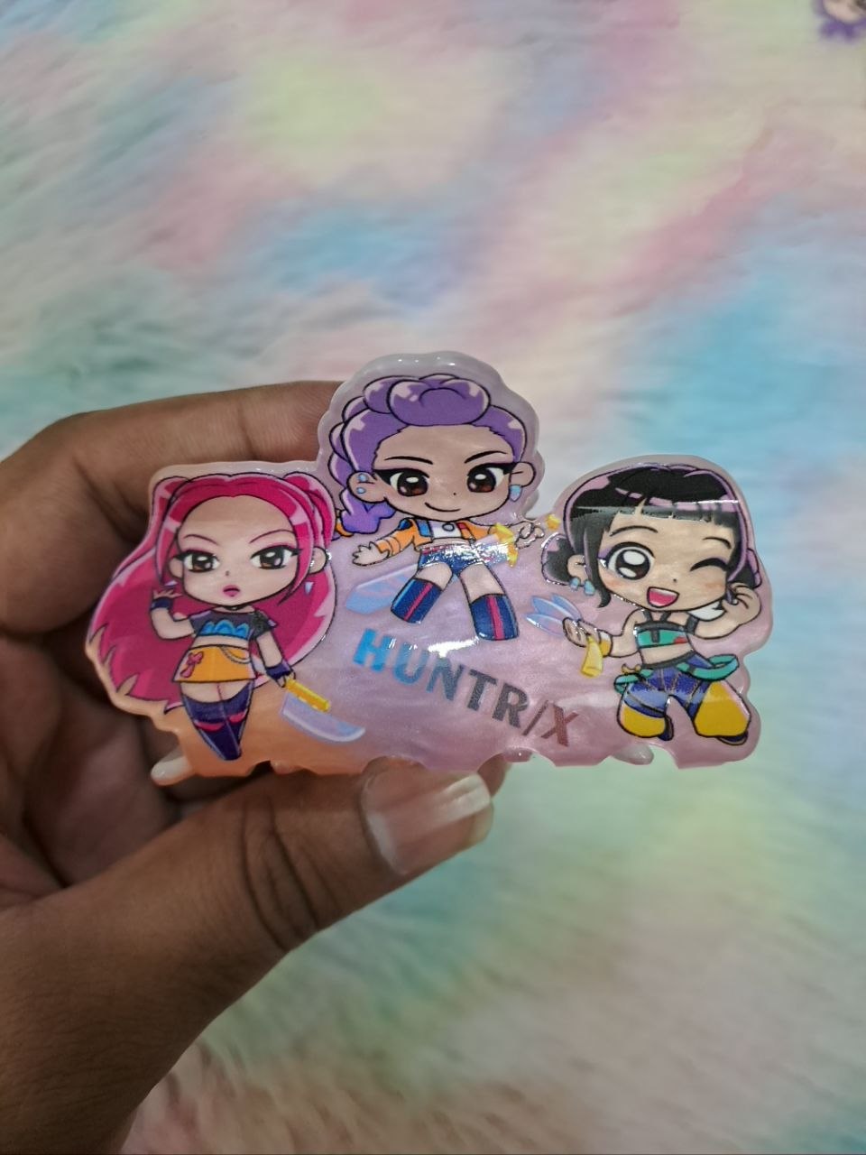 HUNTRIX brand clear acrylic snap hair clips featuring colorful chibi-style anime character graphics for girls