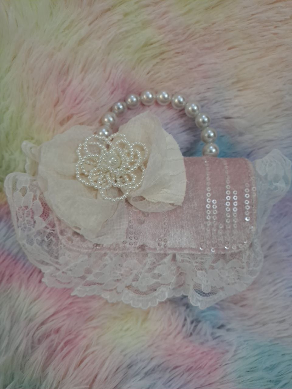 Soft pink sequined evening bag with elaborate delicate lace trim, pearl bead handle, and ivory tulle flower for girls
