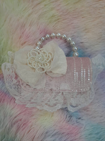 Soft pink sequined evening bag with elaborate delicate lace trim, pearl bead handle, and ivory tulle flower for girls
