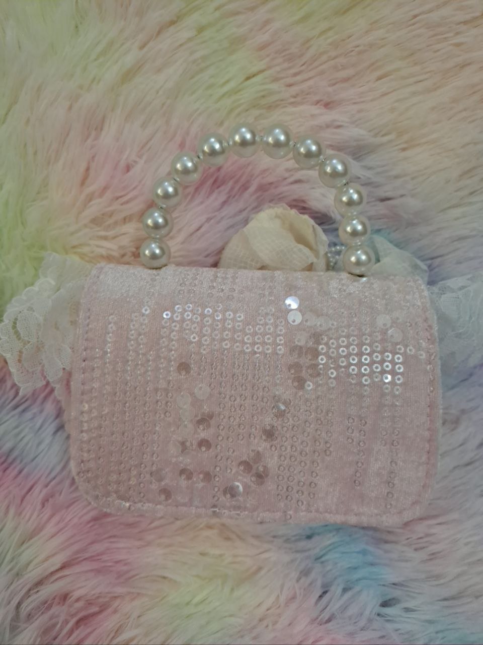 Soft pink sequined evening bag with elaborate delicate lace trim, pearl bead handle, and ivory tulle flower for girls
