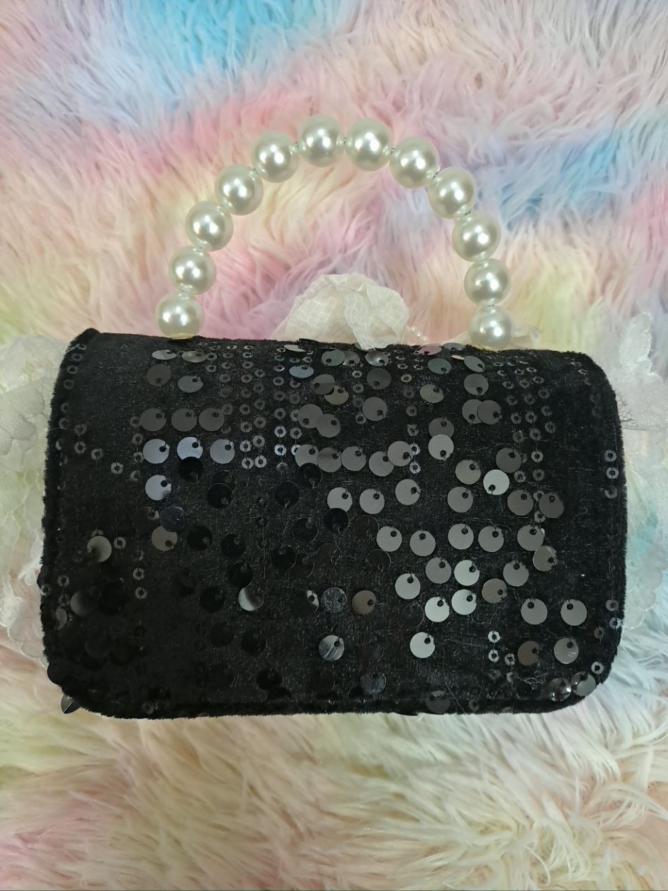 Black sequined evening bag with delicate ivory lace trim, pearl bead handle, and ivory tulle flower for girls