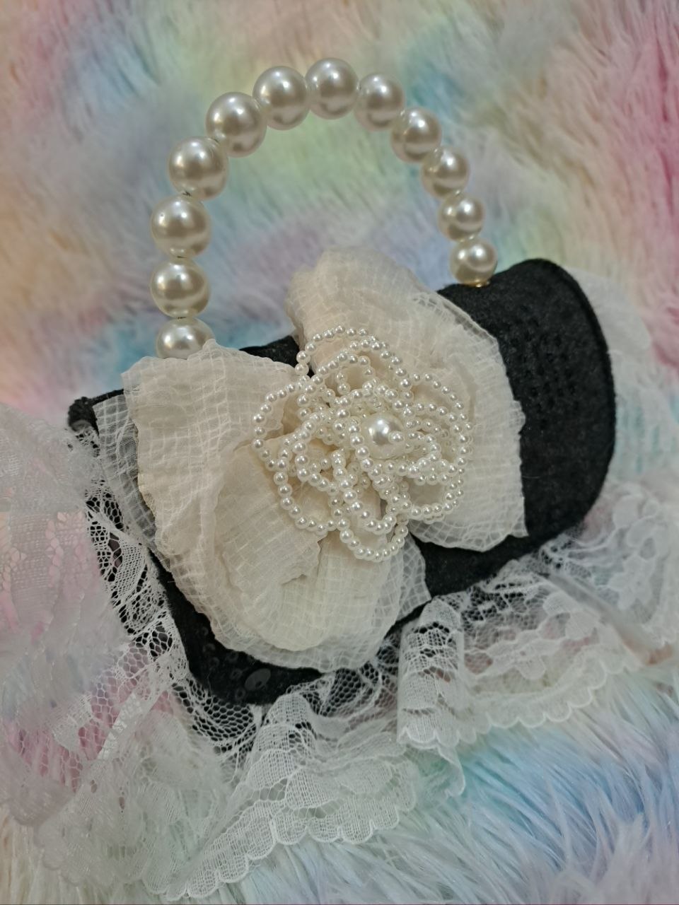 Black sequined evening bag with delicate ivory lace trim, pearl bead handle, and ivory tulle flower for girls