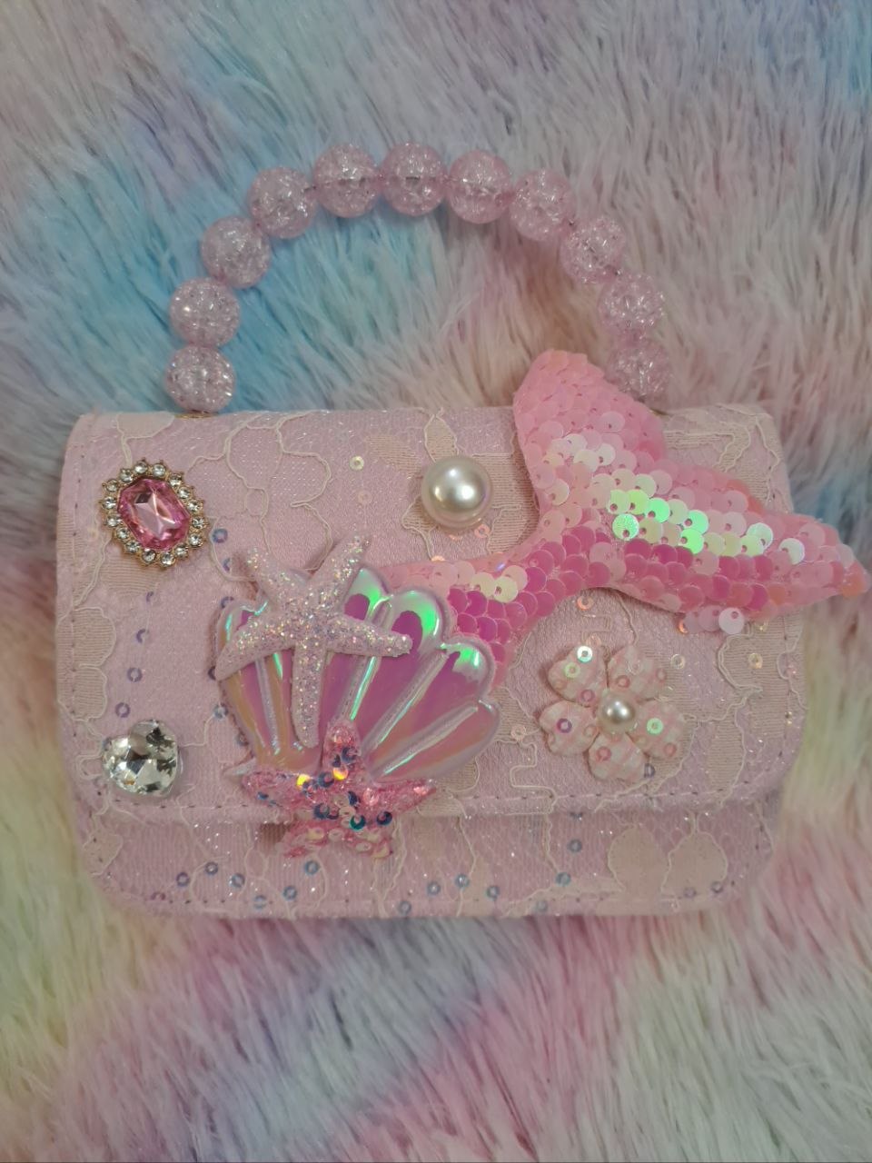 Pink bag with iridescent holographic shell, glitter starfish, pearl flower, and pink crystal bead handle for girls