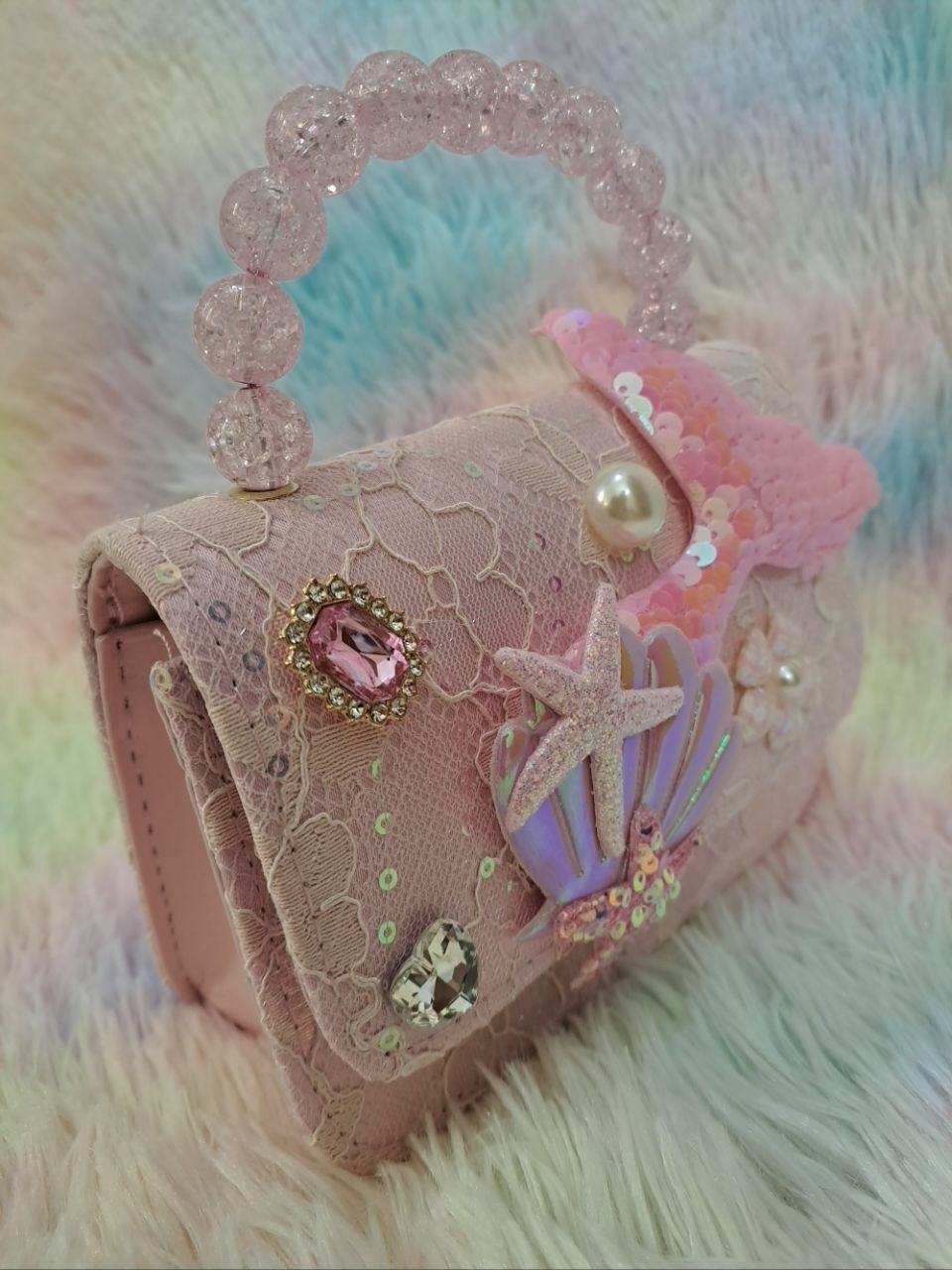 Pink lace evening bag with iridescent holographic shell, glitter starfish, pearl flower, and pink crystal bead handle for girls