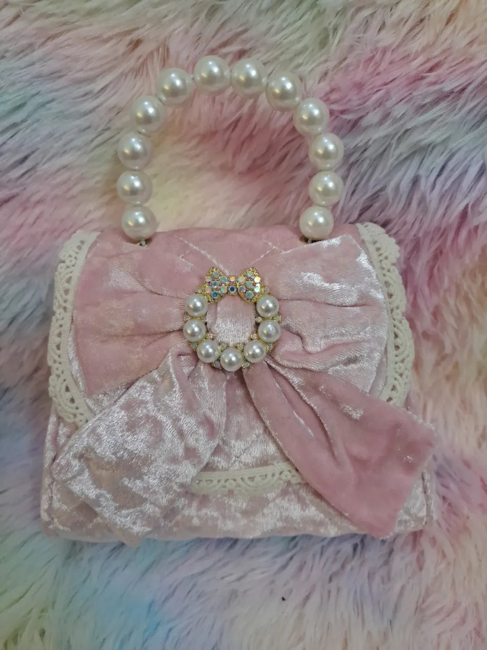 Pink crushed velvet evening bag with pearl bead handle, large satin bow with jeweled and pearl brooch centerpiece for girls
