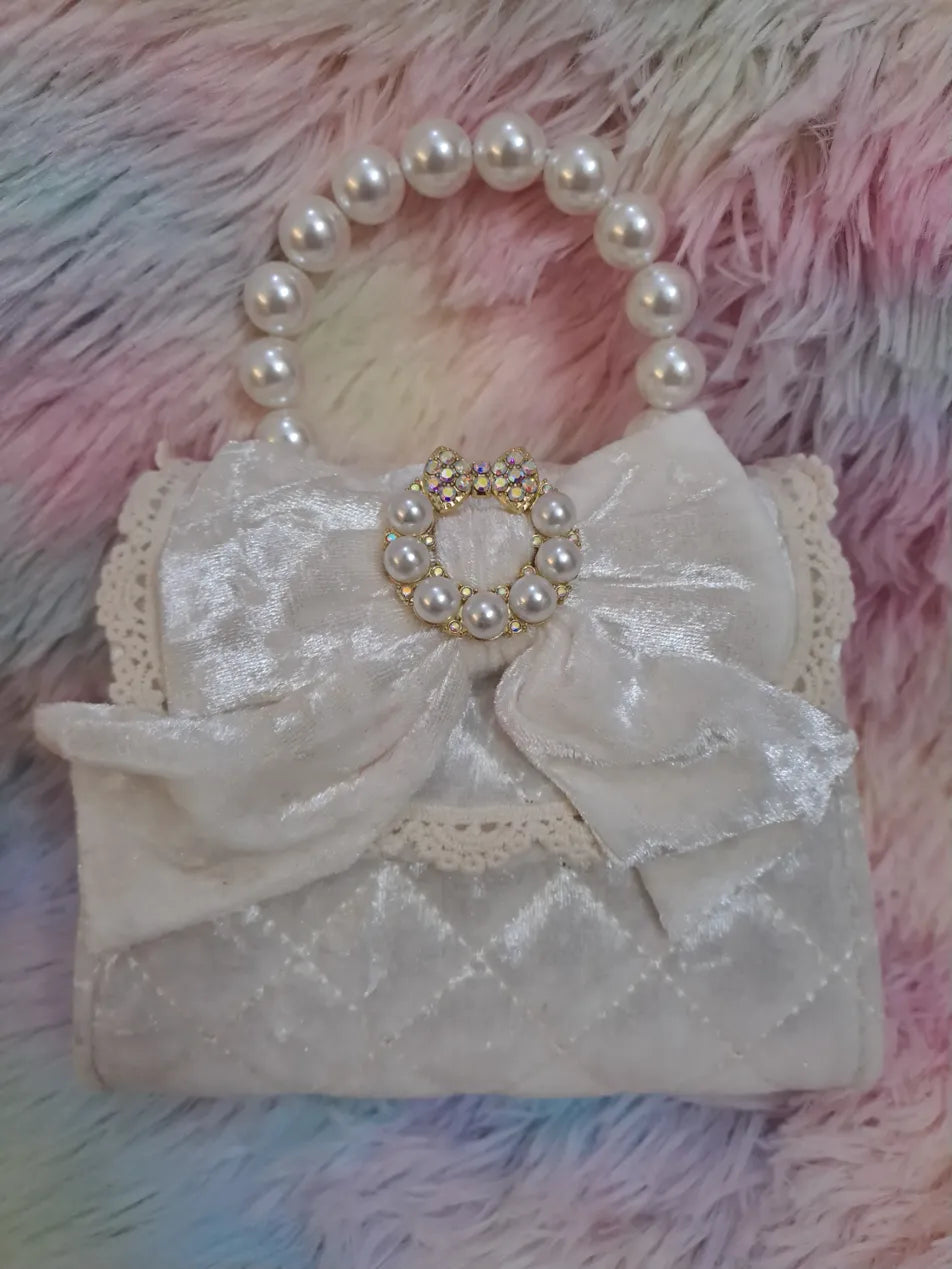Ivory quilted satin evening bag with pearl bead handle, large bow with iridescent crystal and pearl jeweled brooch centerpiece for girls
