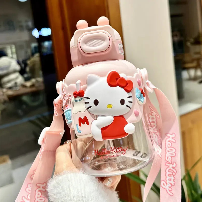 Pink Hello Kitty 3D sculpted Sanrio official kids straw water bottle with red bow character figure, robot-shaped lid, and printed Hello Kitty shoulder strap