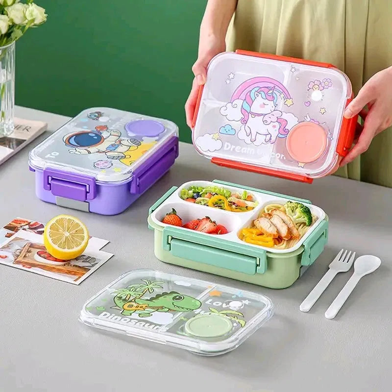 
Kids cartoon clear-lid bento lunch box with divided compartments showing Astronaut purple, Dream Unicorn red, and Dinosaur green designs, transparent cartoon lid, built-in sauce cup, included spoon and fork, BPA-free school tiffin box
