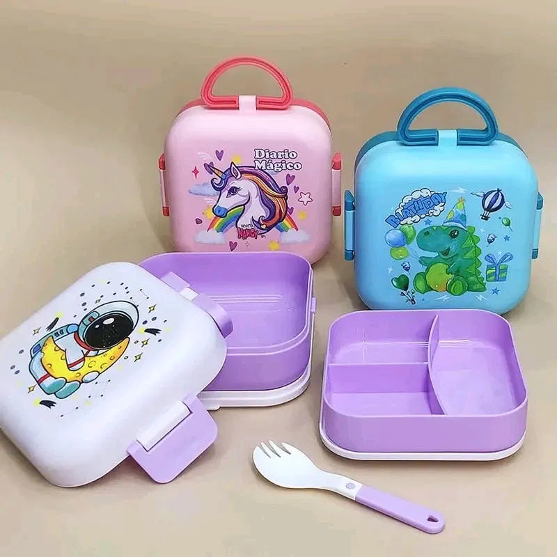 Kids cartoon suitcase-handle lunch box set featuring Diario Magico Unicorn pink, Birthday Dinosaur blue, and Astronaut white-purple designs, with removable divider tray compartments, secure clip latch, and included fork, BPA-free school tiffin