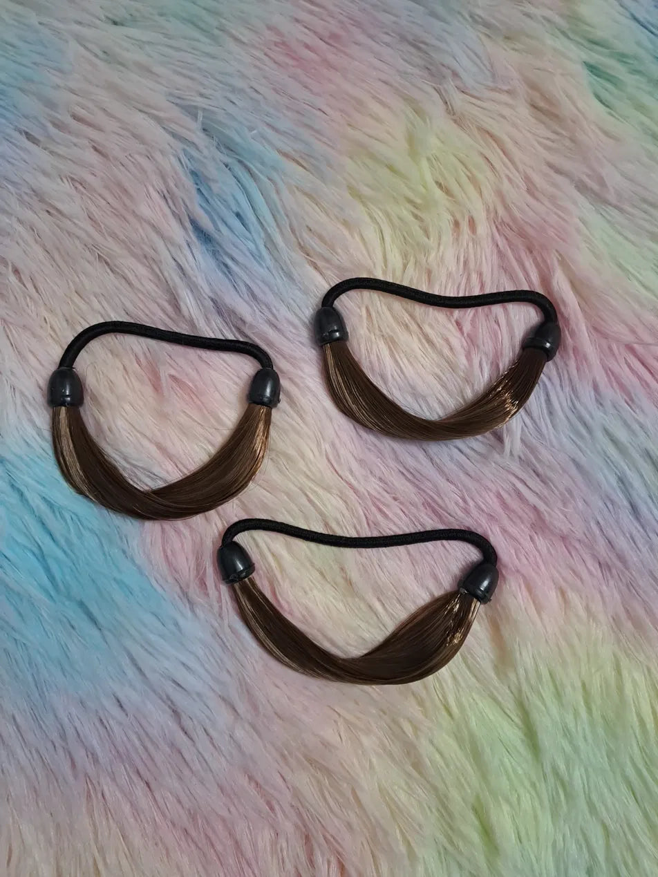 Brown faux synthetic hair ponytail elastic hair ties 3-pack with soft hair strands attached to black elastic and barrel connector ends, hair extension effect hair bands