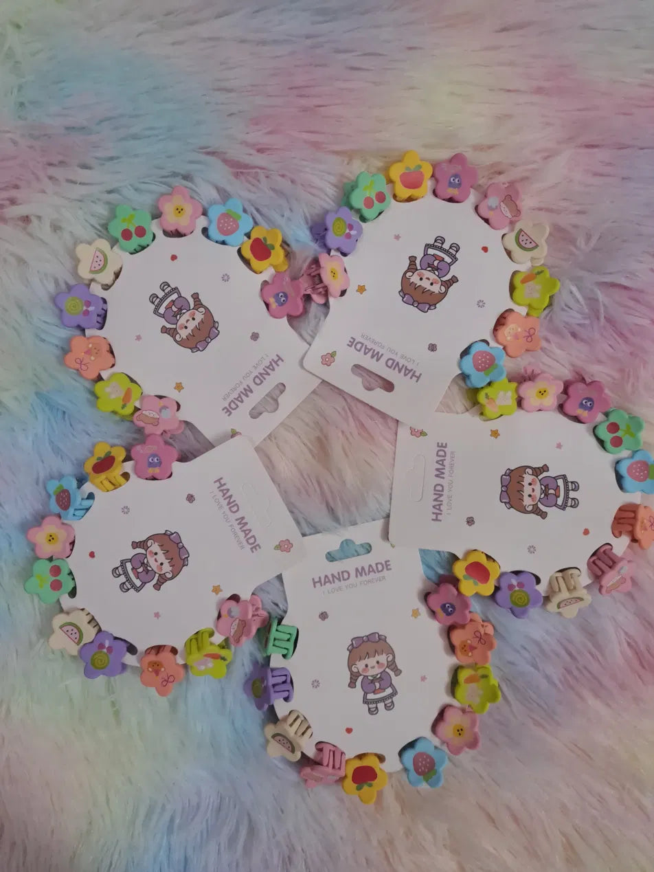 Handmade fruit flower mini hair claw clip set on illustrated display card featuring colourful floral and fruit-shaped mini claw clips including strawberries, watermelons, cherries, apples and blossoms in pastel and bright rainbow colours