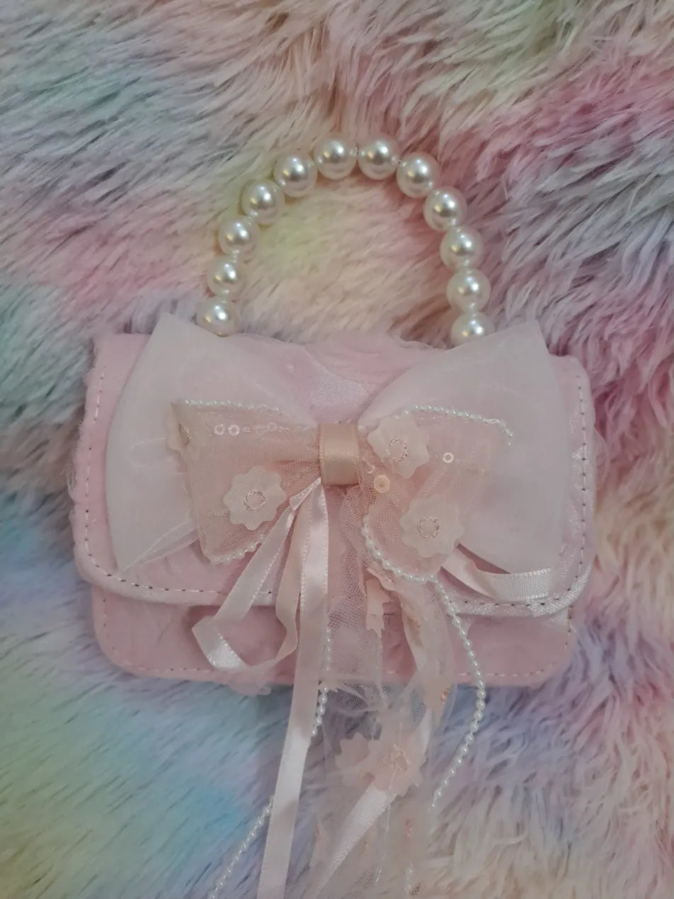 Pink evening bag with pearl bead handle, large tulle bow with lace flower appliqués and pearl embellishments for girls